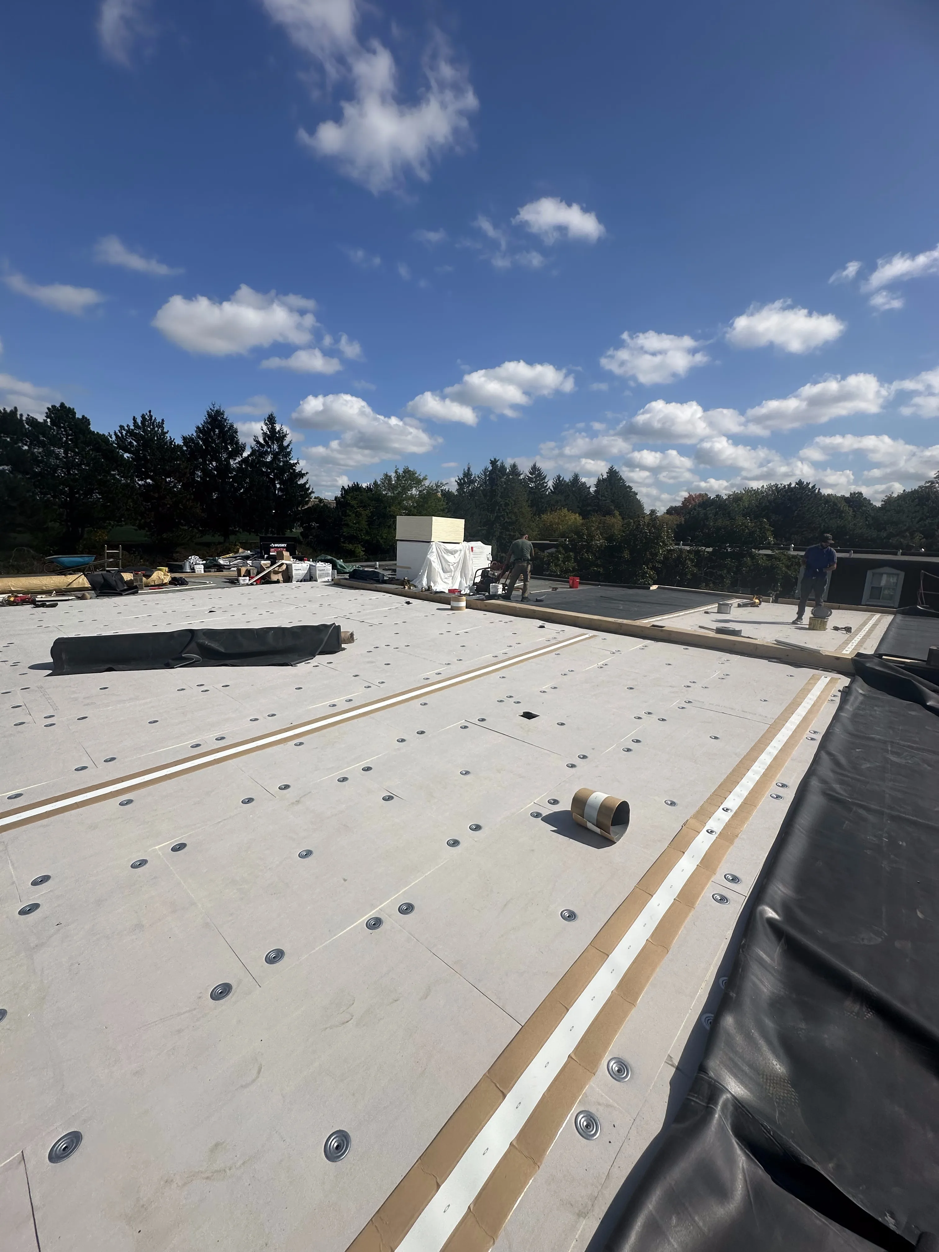TPO membrane installation in progress on a Calgary commercial flat roof