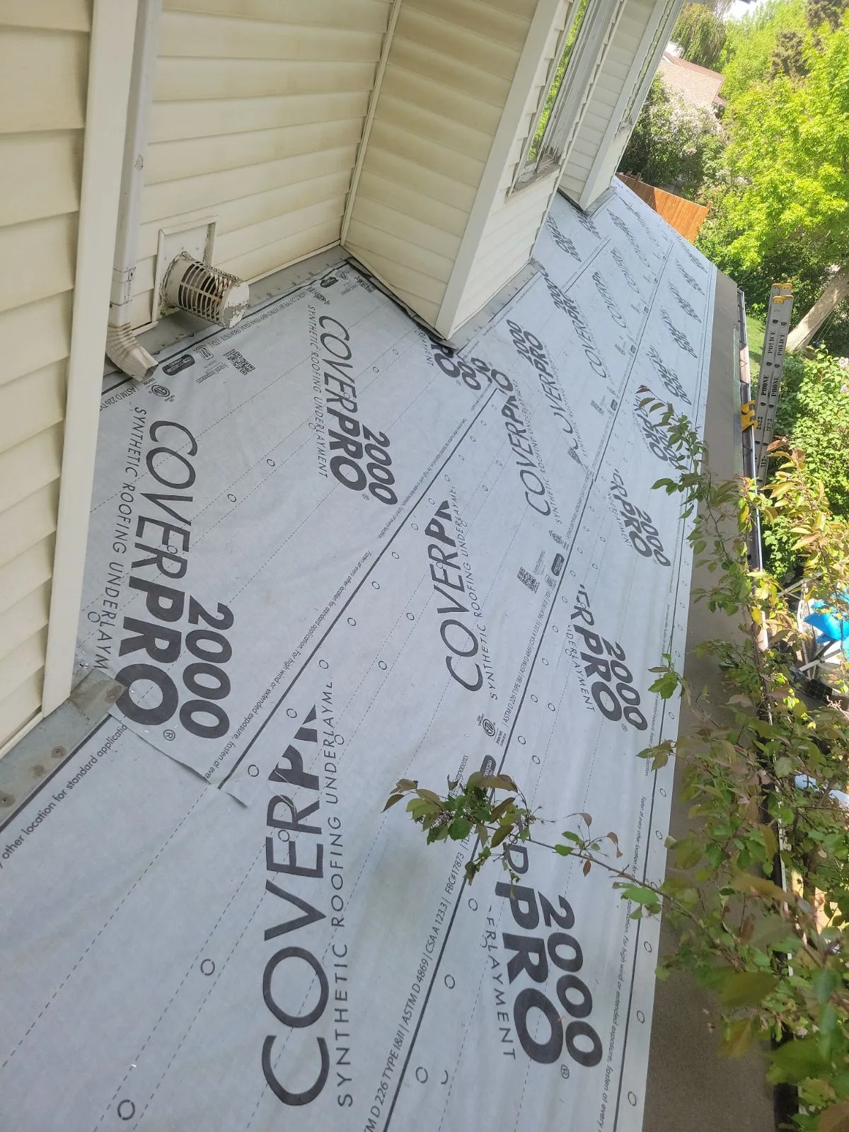 CoverPro 2000 synthetic underlayment beneath new Class 4 shingles in Calgary