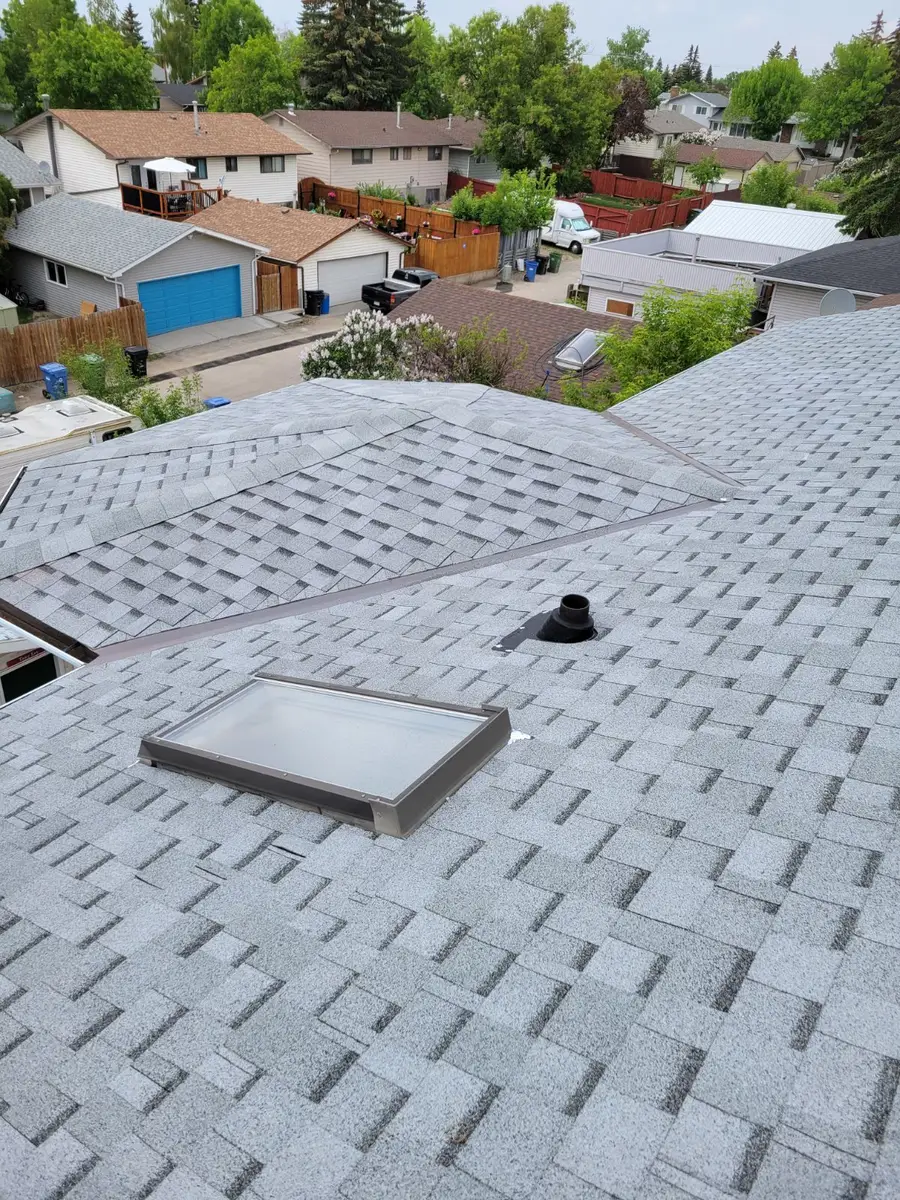Finished Calgary roof with skylight installed by Top Star Roofing