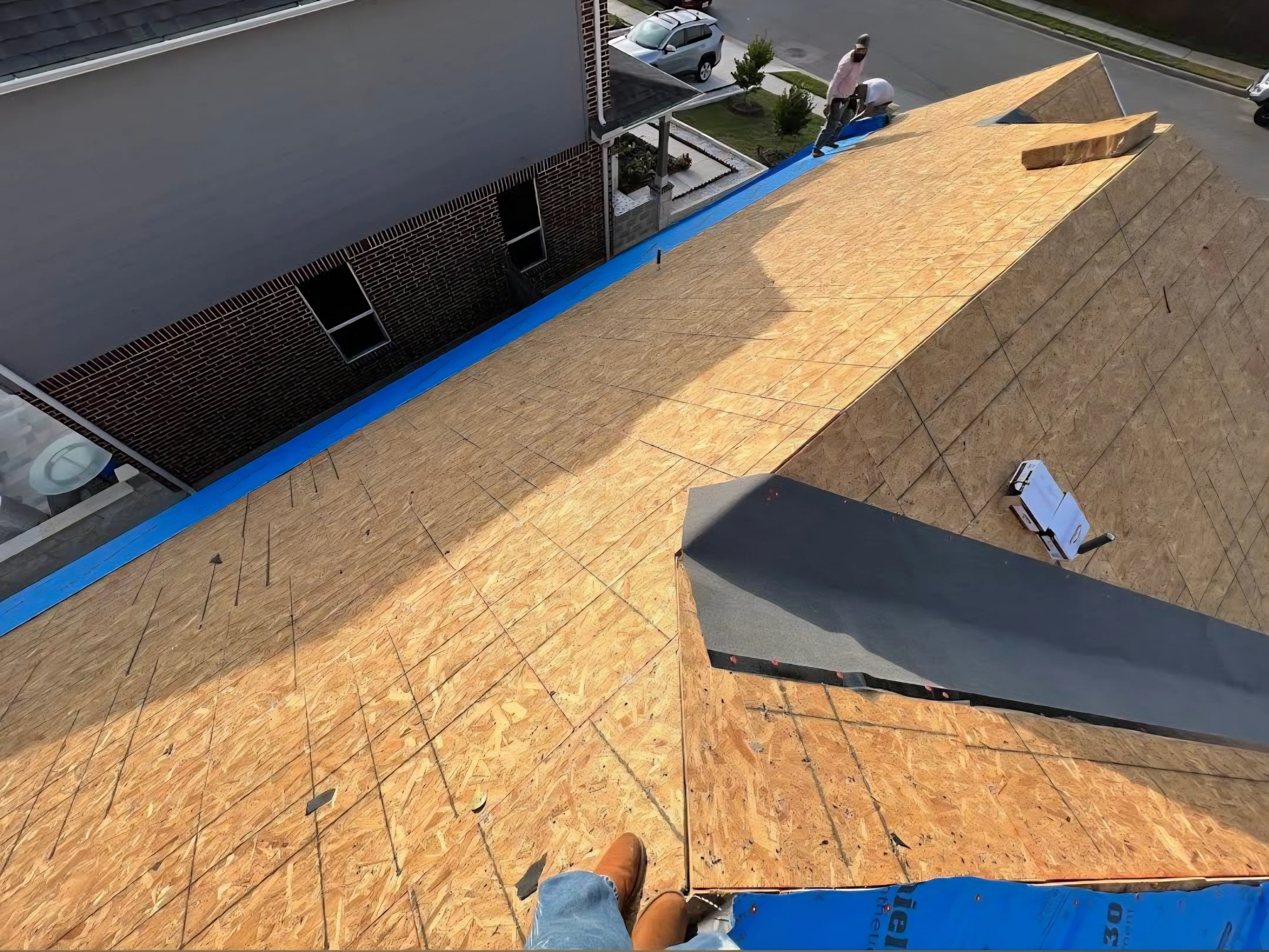 New OSB roof sheathing after attic rain remediation in Calgary