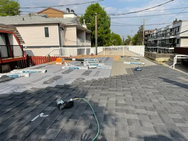 Top Star Roofing crew installing new shingles on a Calgary home